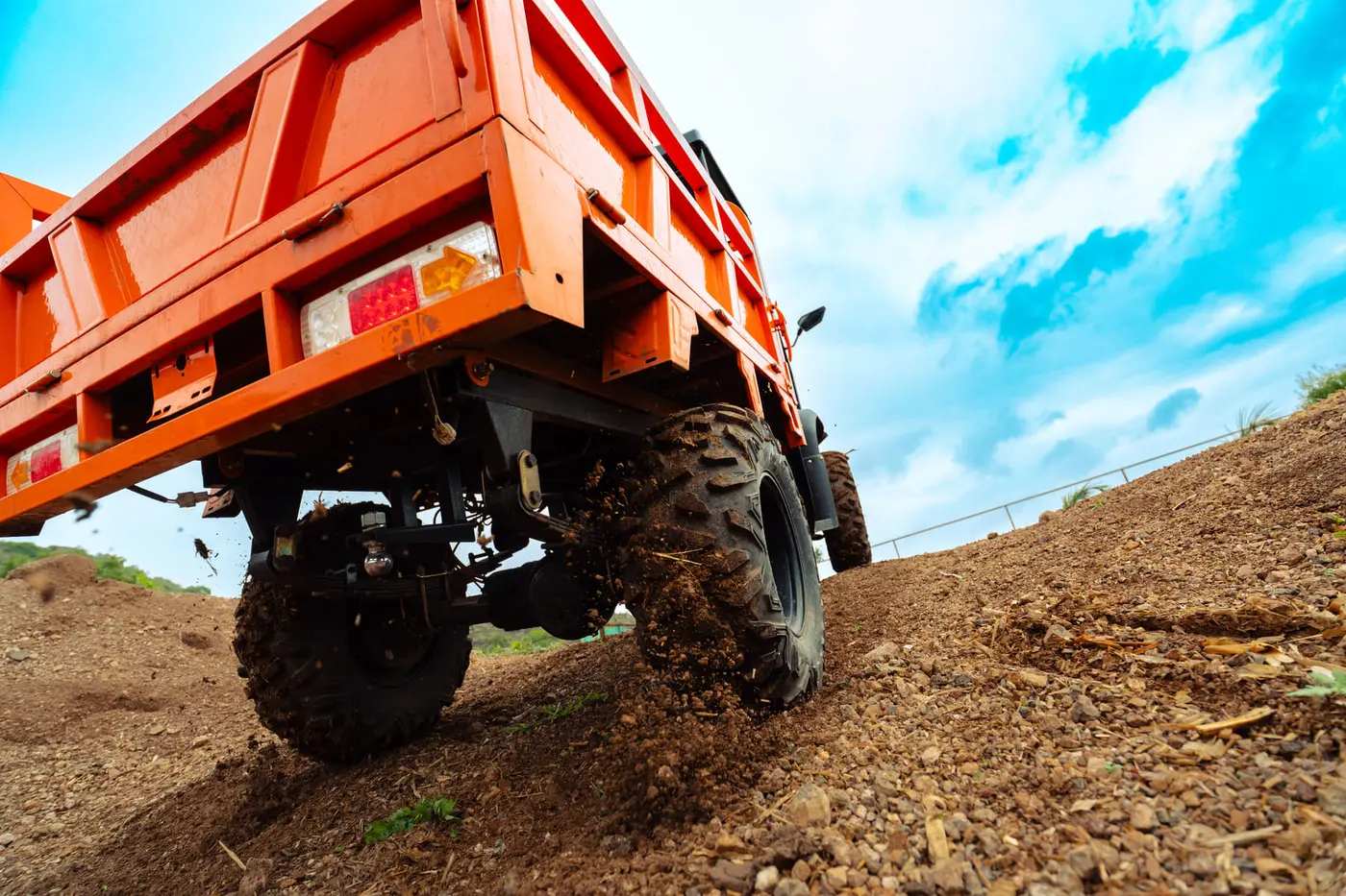 Tunwal E-ATV with its hydraulic cargo bed raised for unloading